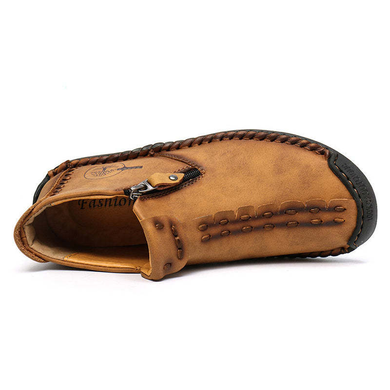 Tan men's ankle boots, side view with side zipper and decorative stitching
