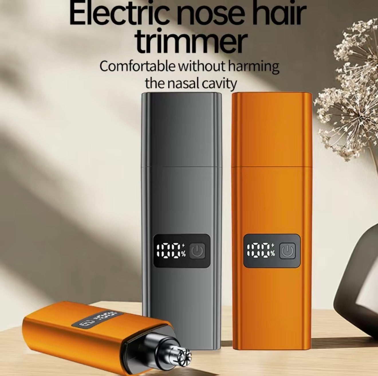 Nose trimmer set with orange and dark gray bodies and protective cap on display panel