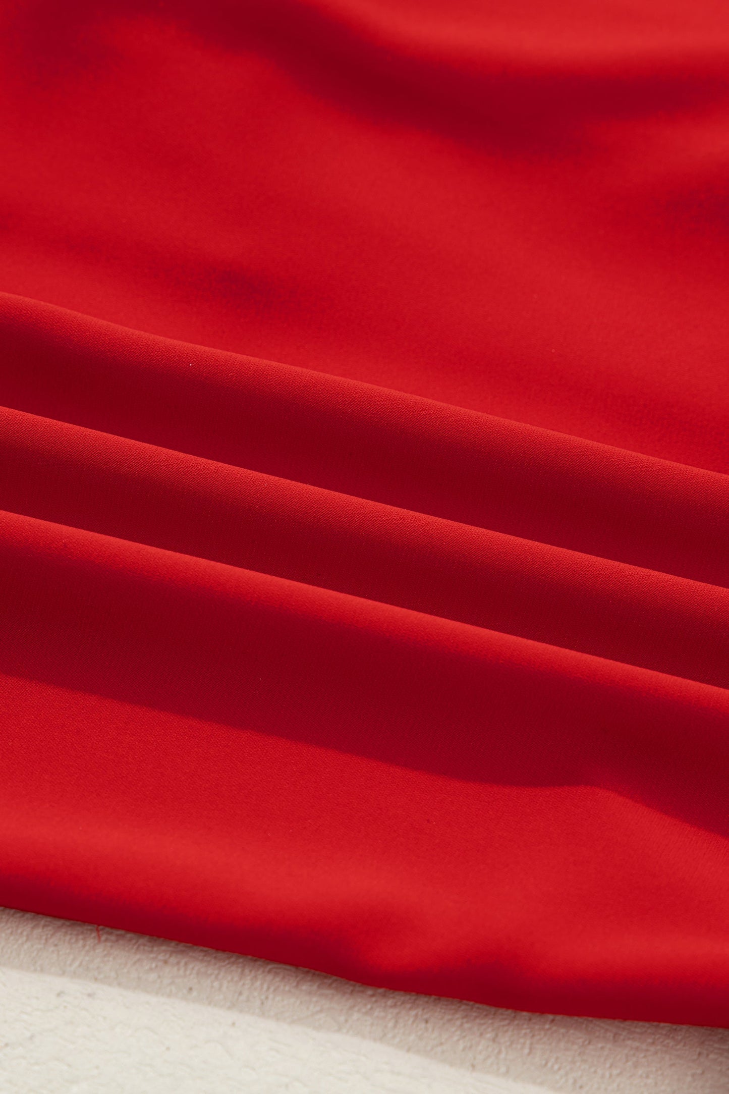 Red silky pajama fabric with smooth drape texture