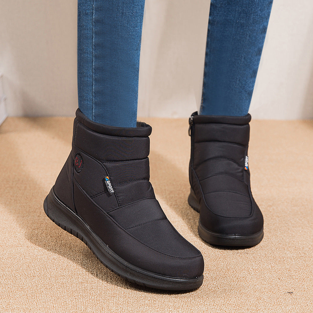 Women’s black ankle boots with padded collar and black rubber sole
