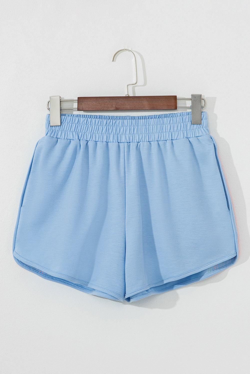 Light blue high-waist active shorts with elastic waistband, no side stripes