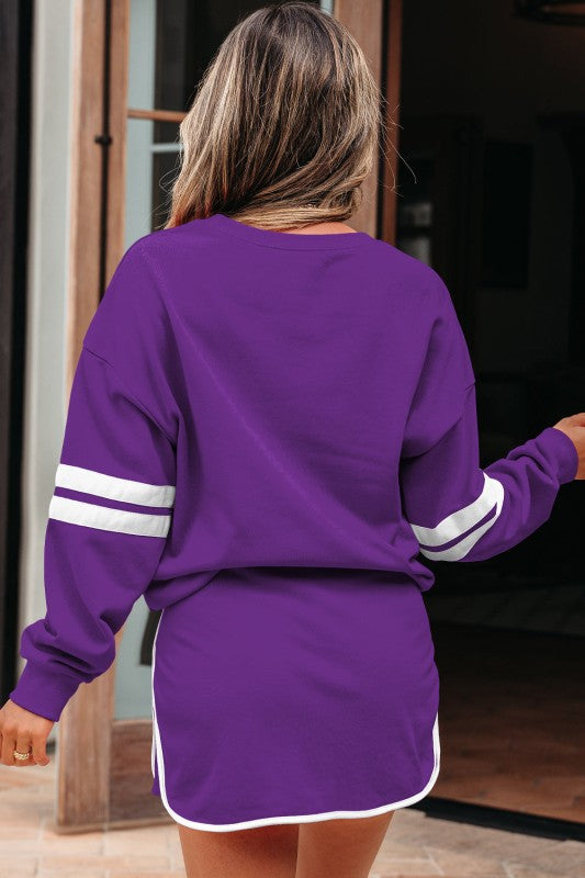 Purple pullover and mini skirt set with white striped cuffs and drawstring hem.