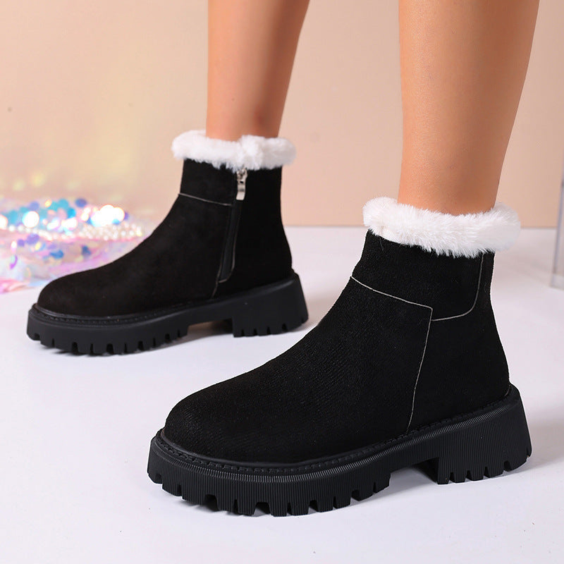 Black suede ankle boots with white faux-fur cuff and thick platform lug sole