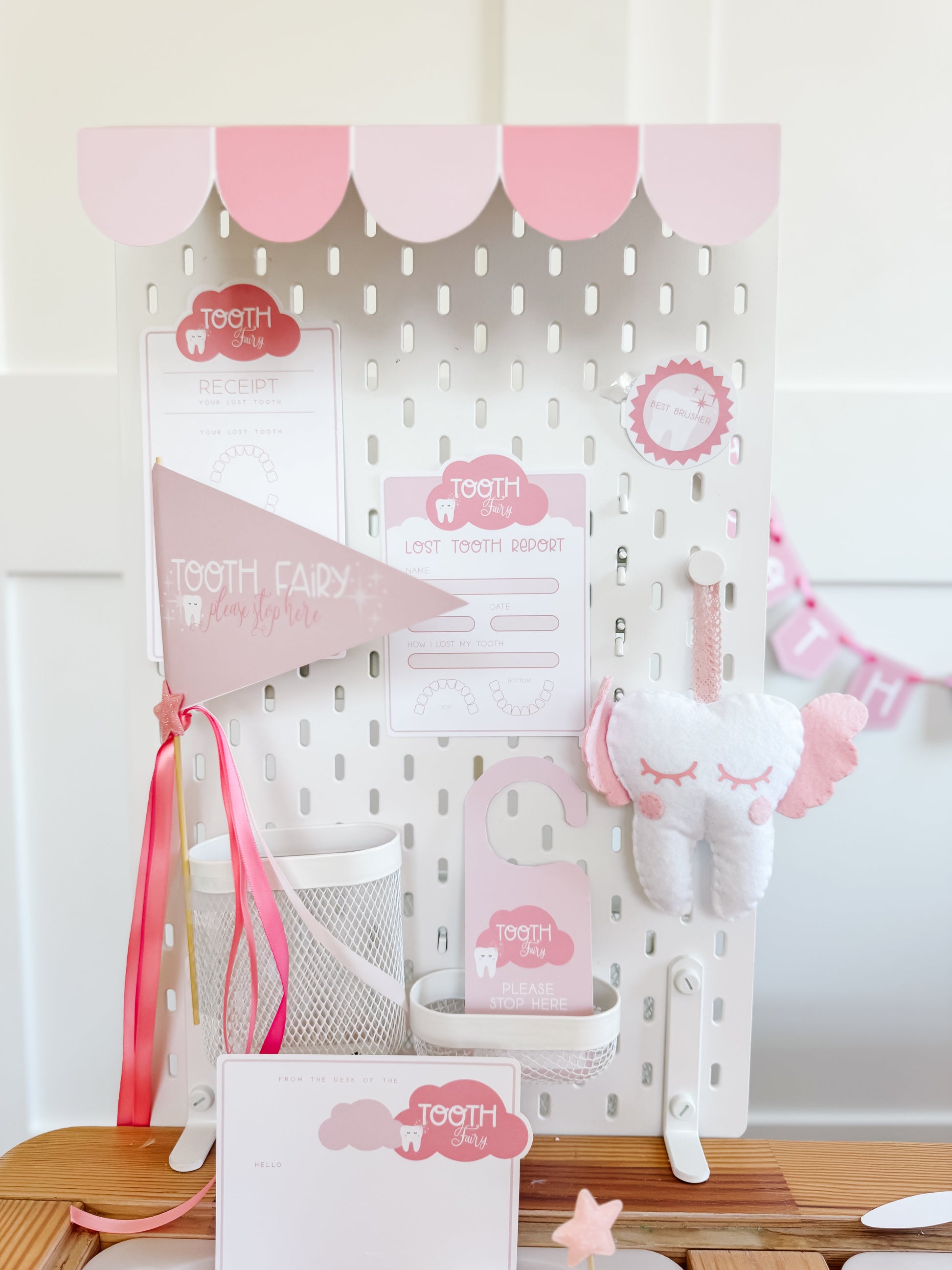 Tooth fairy pegboard play set with hanging tooth plush and decorative tooth-themed cards