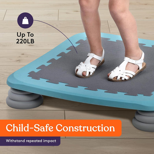 Blue kids rebounder board with gray textured surface and four gray spring bases under feet