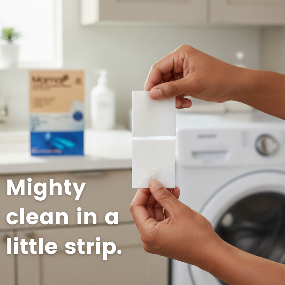Sensitive skin laundry detergent sheets being placed by hand near a washing machine