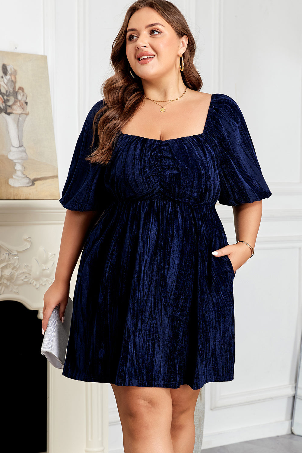 Navy blue short puff-sleeve dress with square neckline and gathered waist