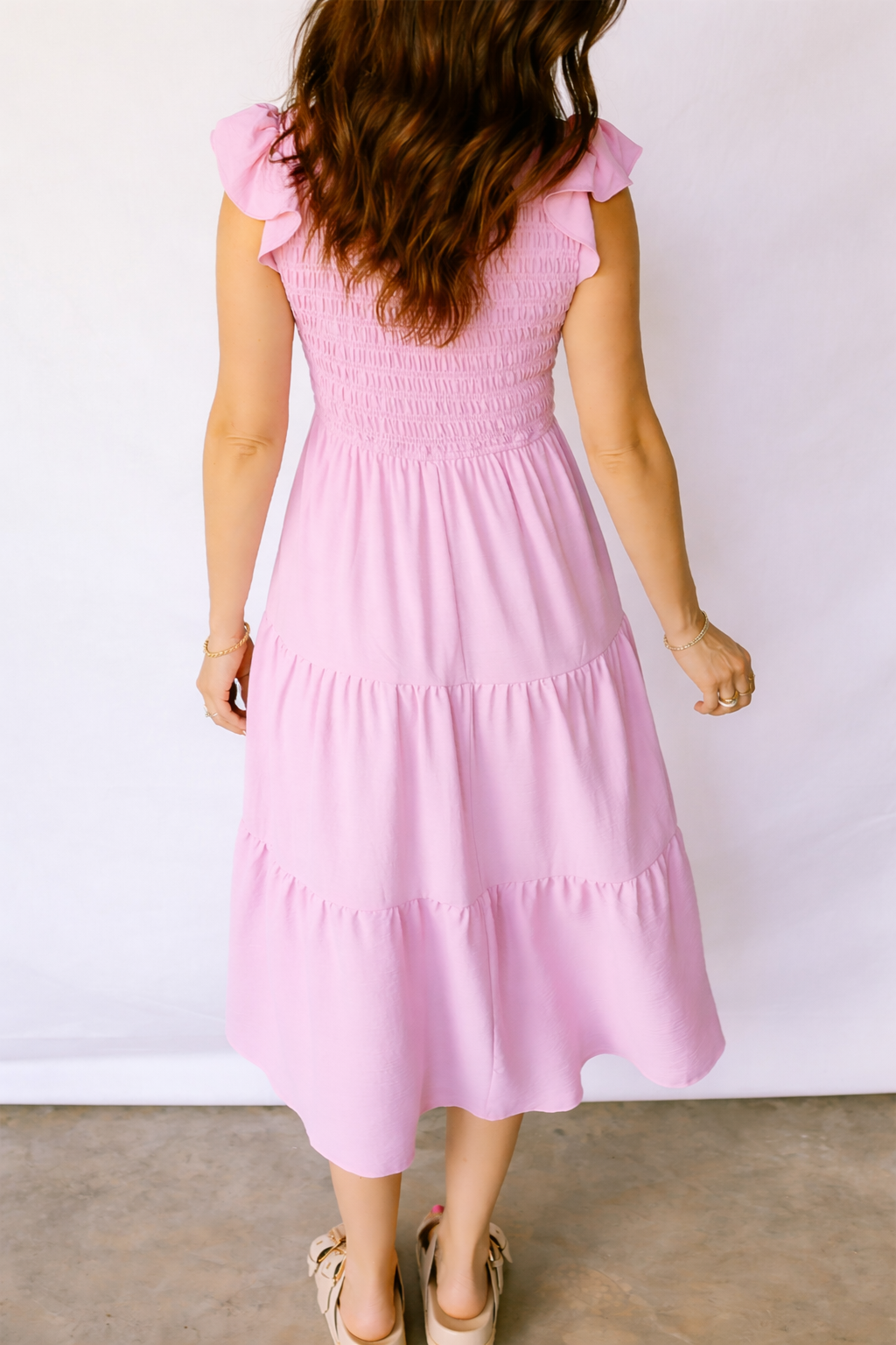 Pink tiered midi dress with smocked back and flutter cap sleeves