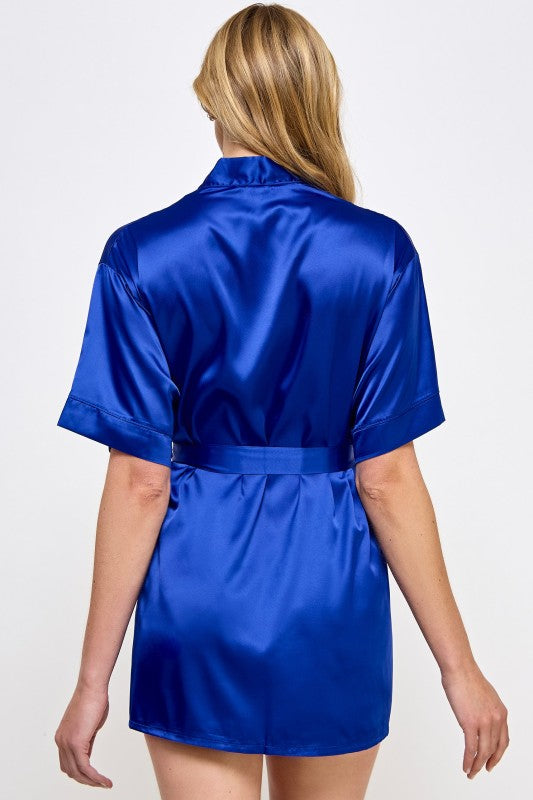 Blue satin robe back view with short sleeves and tied waist belt