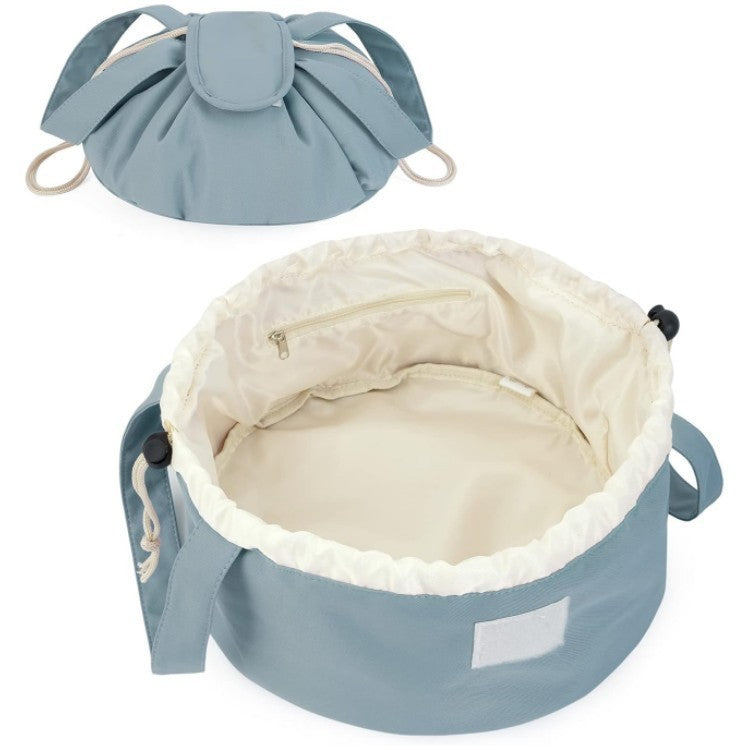 Sky blue drawstring makeup bag interior with ruffled lining and inner zippered pocket