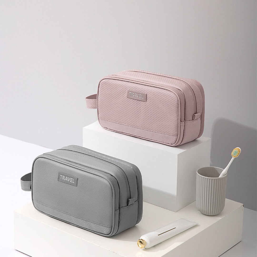 Travel toiletry bag set with two sizes, pink and gray exterior, top zipper