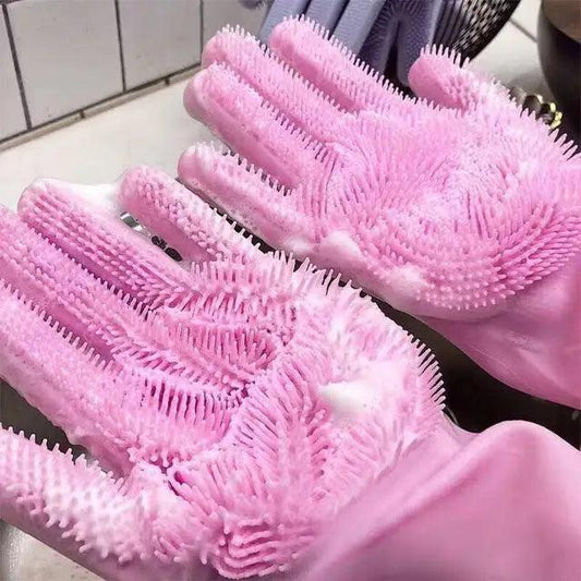 Pink reusable cleaning sponge gloves with textured scrub bristles on palms and fingers