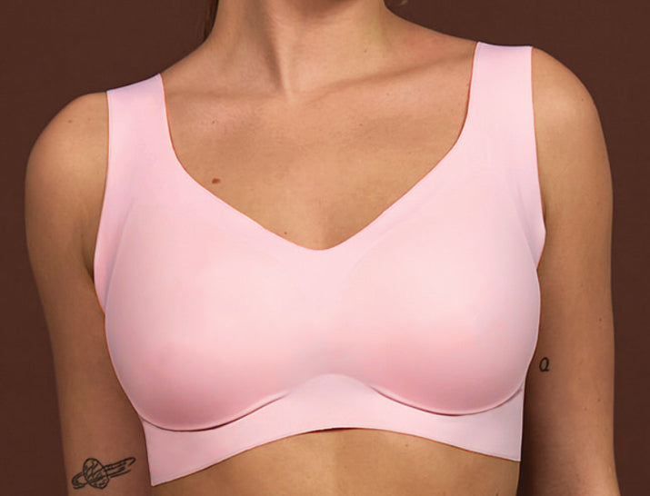 Pink V-neck lift bra with shallow V neckline and smooth molded cups