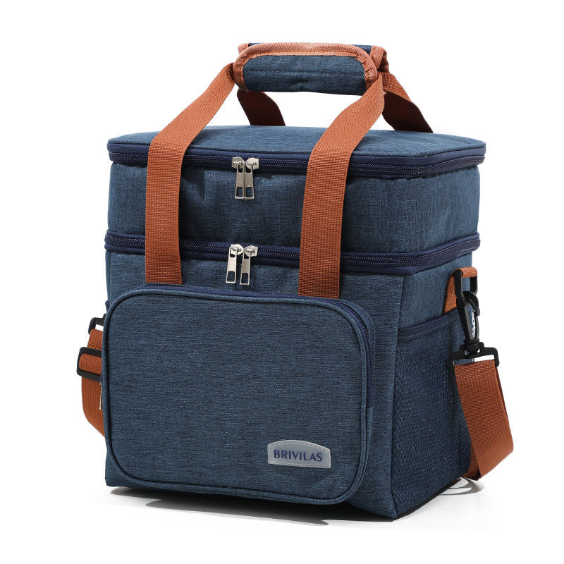 Navy insulated lunch bag cooler crossbody with orange webbing straps and front pocket