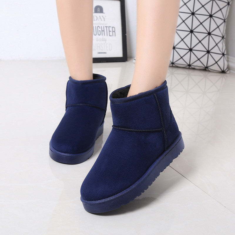 Women’s winter snow boots in navy suede with faux fur lining and thick treaded sole