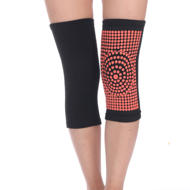 Black self-heating knit knee pad with red dot heat panel