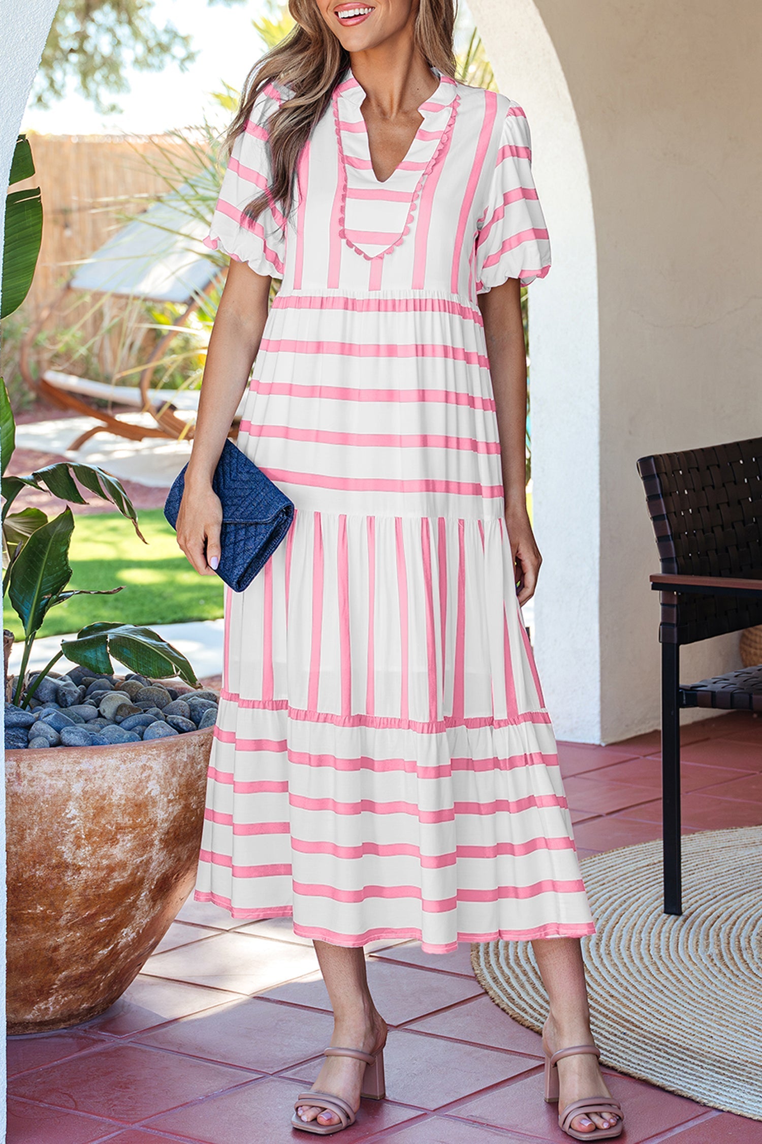 Pink striped half-sleeve tiered vacation dress with V-neck ruffle trim and full skirt