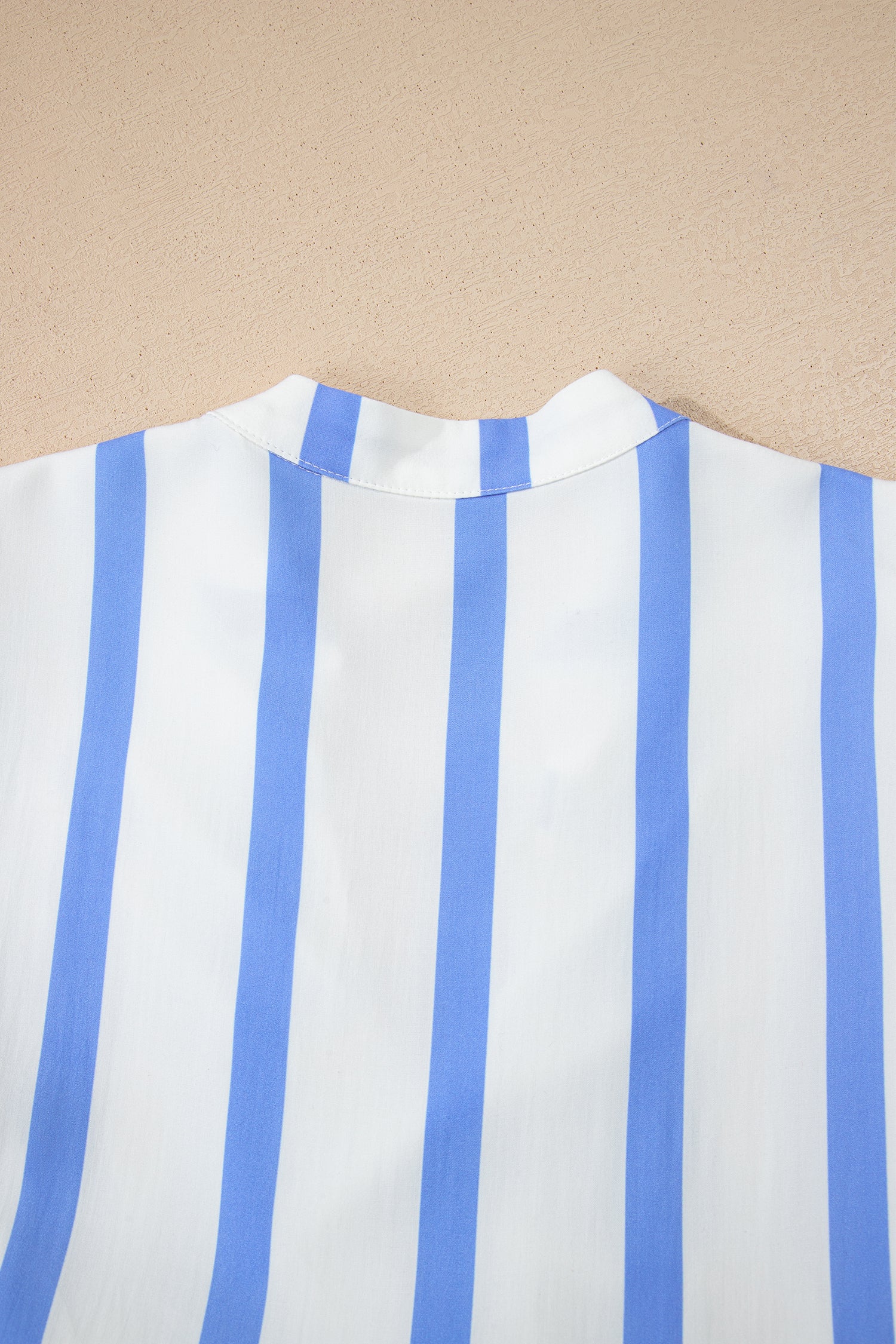 Blue-and-white striped dress back with wide neckline and straight shoulder seams