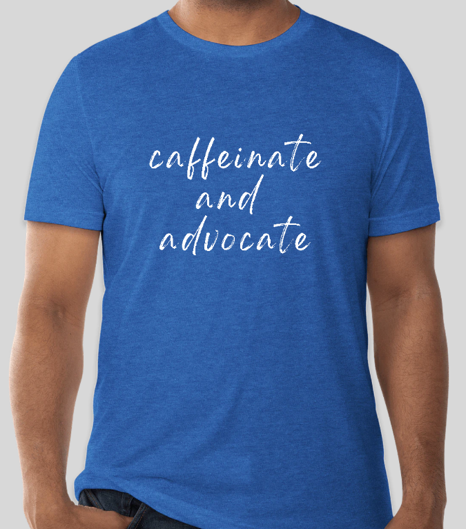 Blue crew-neck T-shirt with centered 'caffeinate and advocate' script text