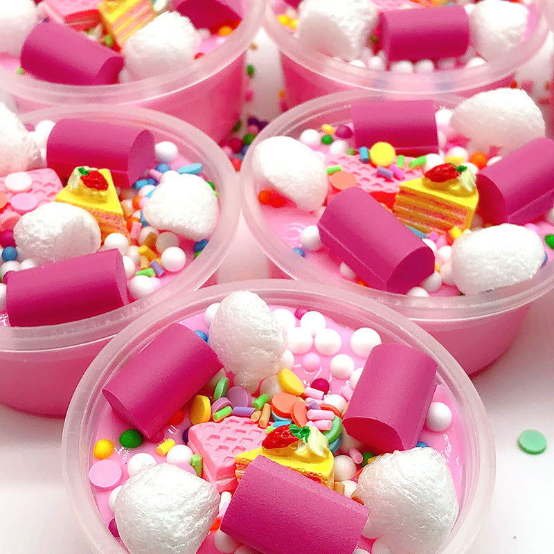 Pink slime jars packed with candy pieces, sprinkles, and white foam bits