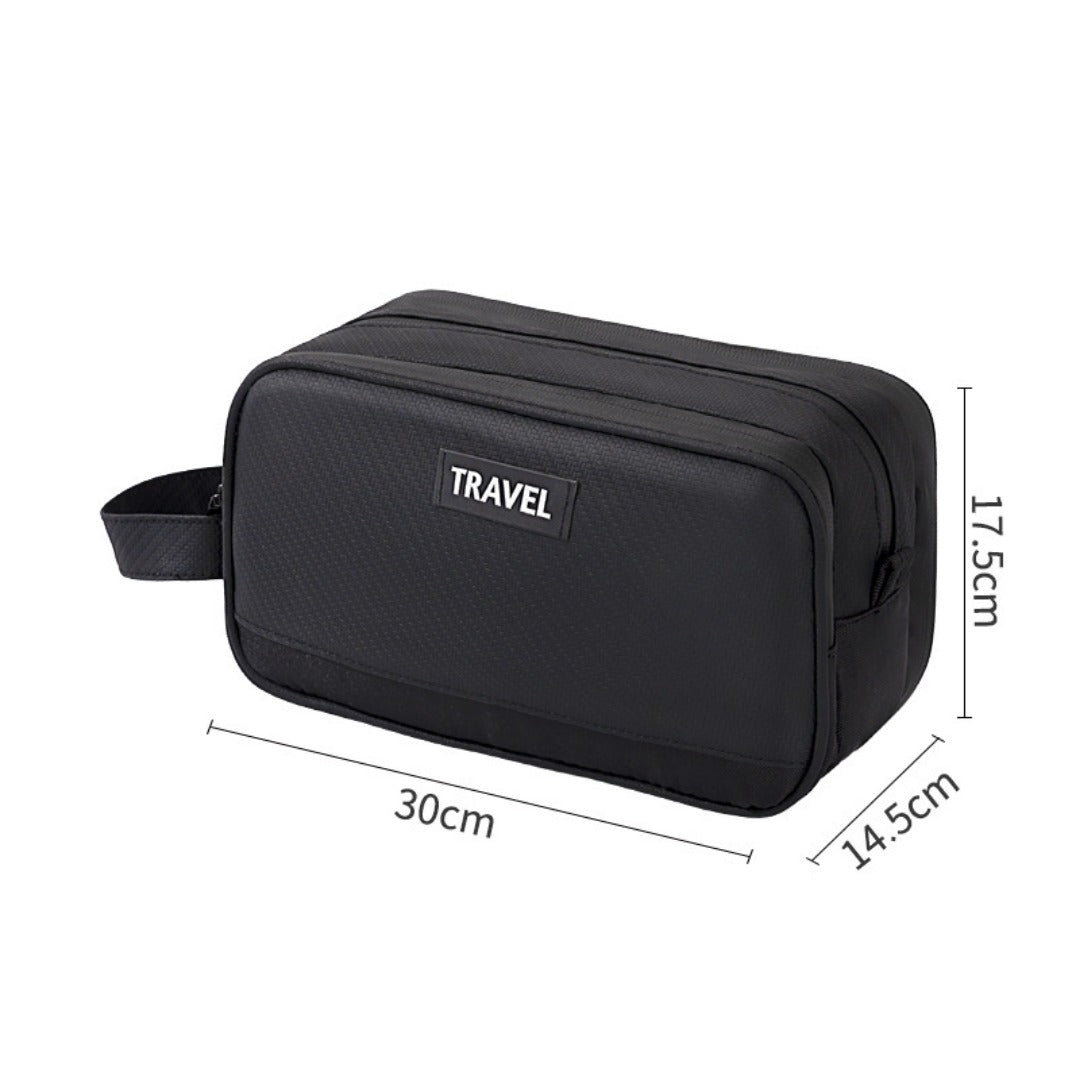Black travel toiletry bag with TRAVEL label, side handle and zipper closure, size shown