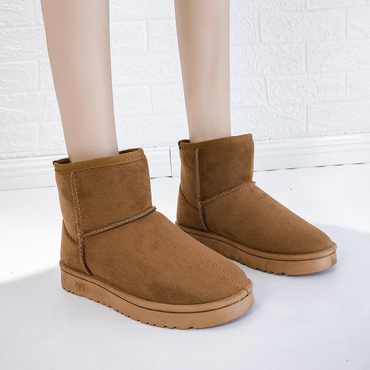 Women’s winter snow boots in tan suede with faux fur lining and thick rubber sole