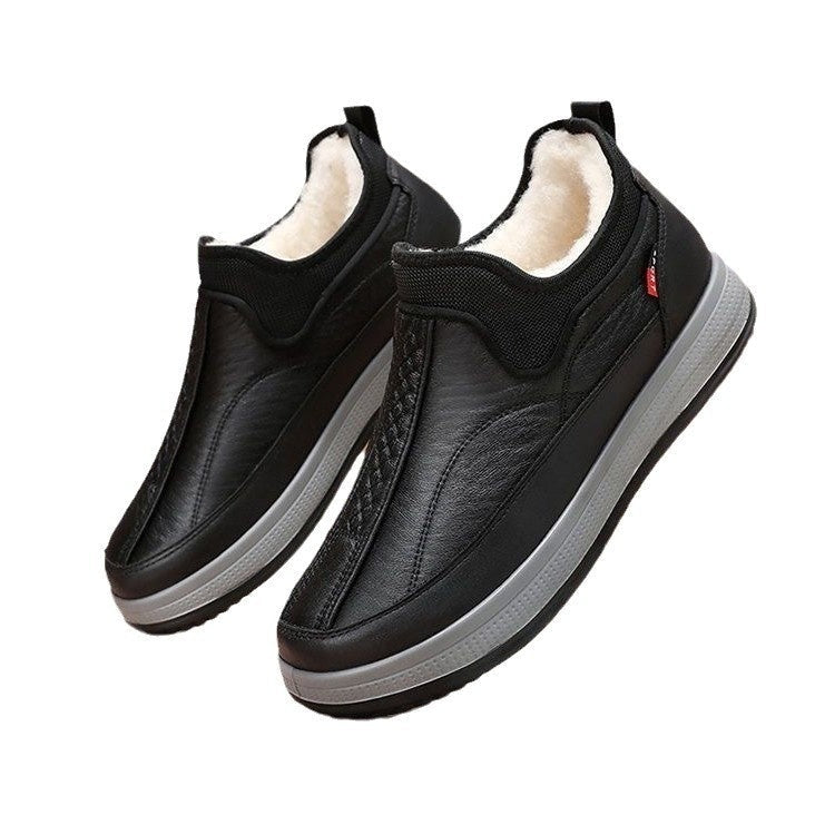 Pair of black ankle boots with fleece lining and textured platform soles
