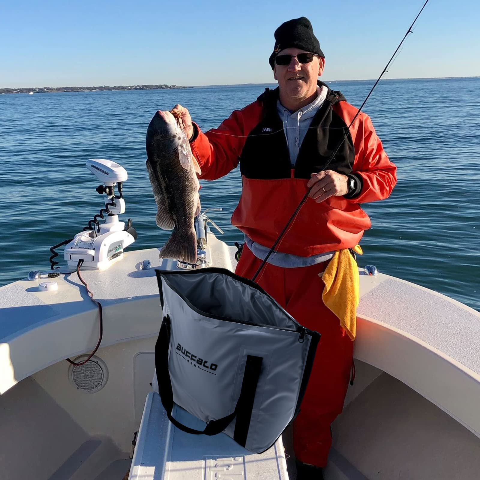 White fish cooler bag with black straps on a boat deck