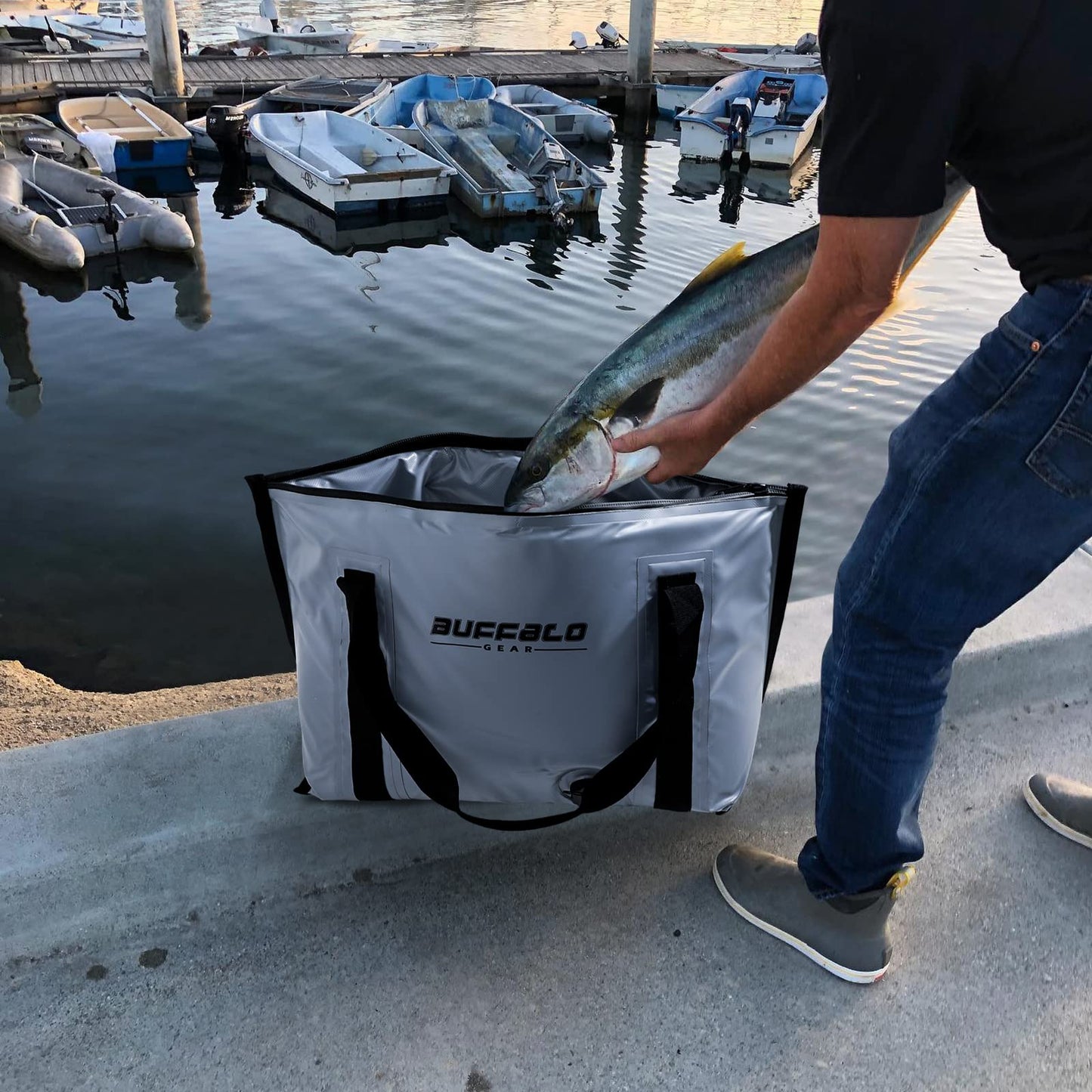 White fish cooler bag held open with fish inside