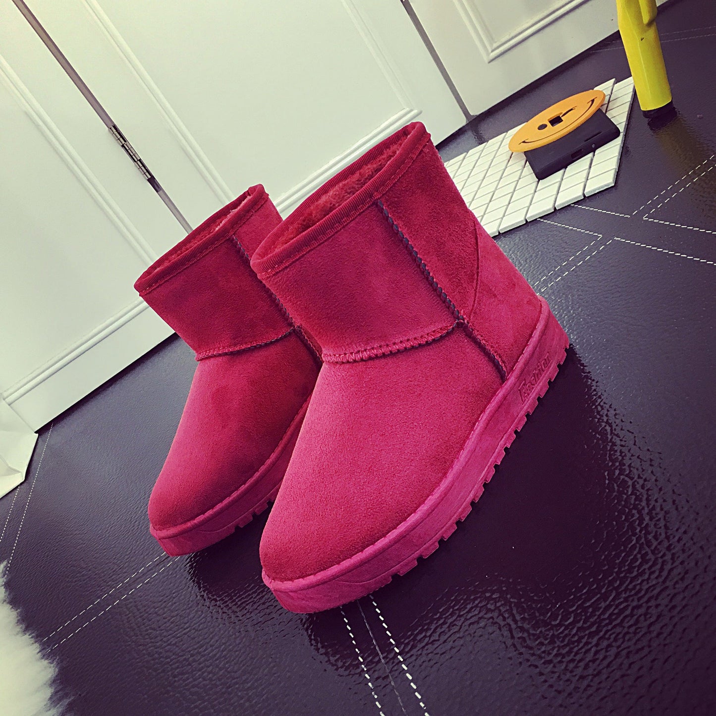 Red winter snow boots with faux-fur lining, ankle height, and textured rubber sole
