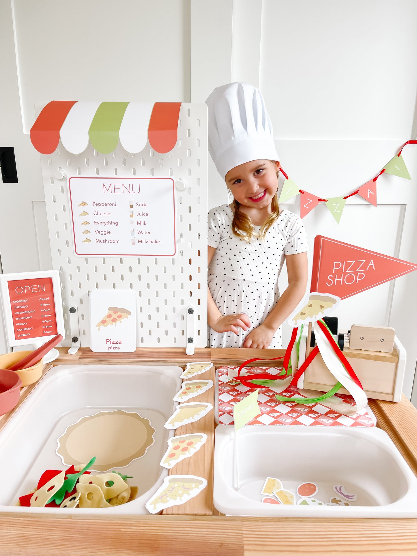 Pizza shop play kit with menu board, pizza shop sign, and pretend food trays
