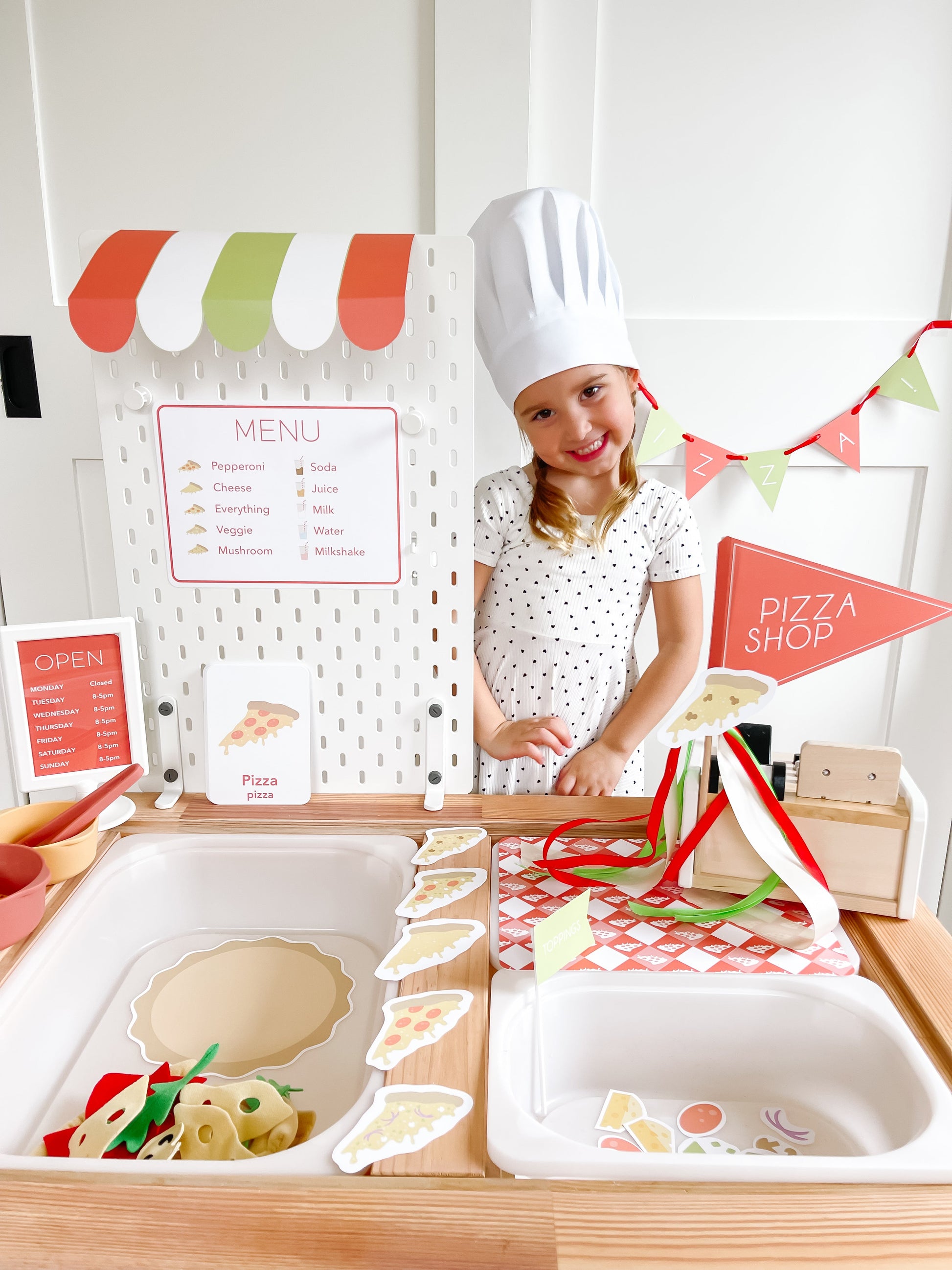 Pizza shop play kit with menu board, pizza shop sign, and pretend food trays