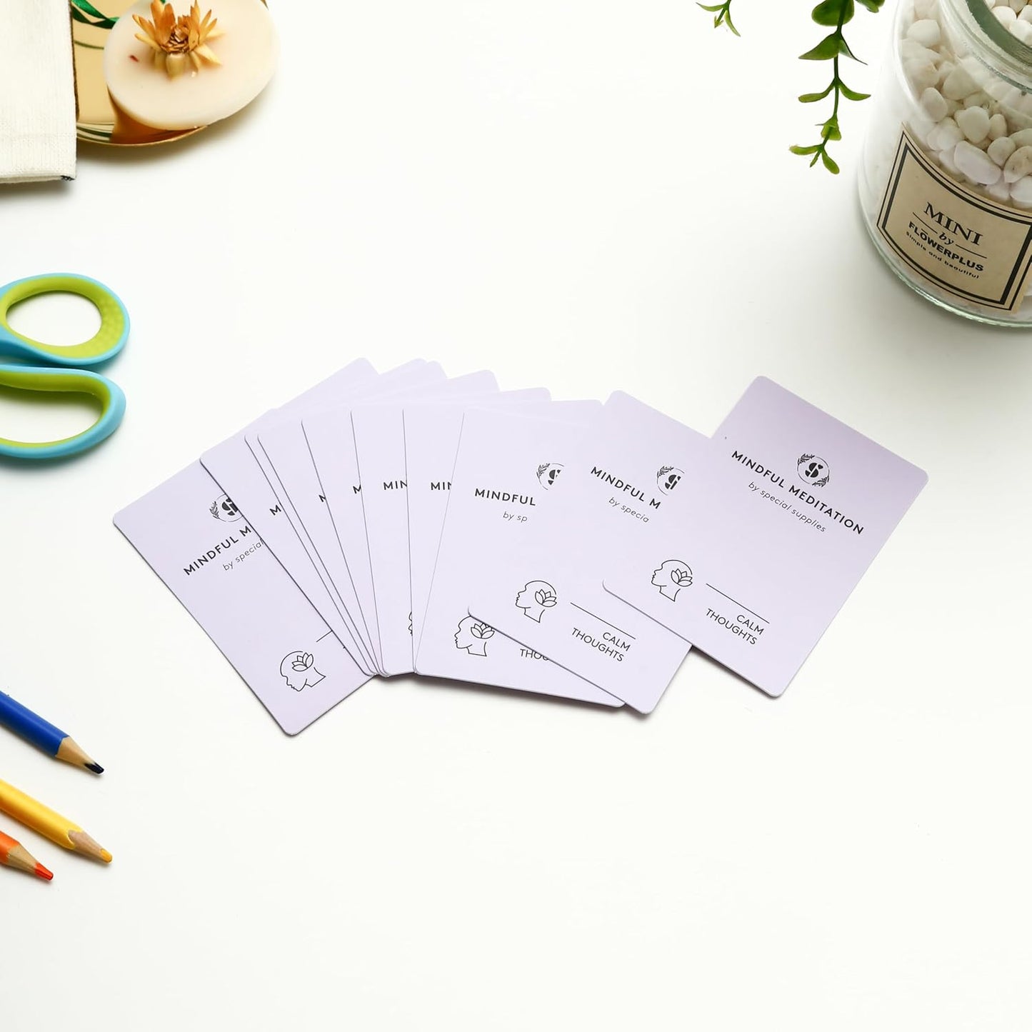 Mindfulness meditation cards laid out in a row with simple line icons on fronts.