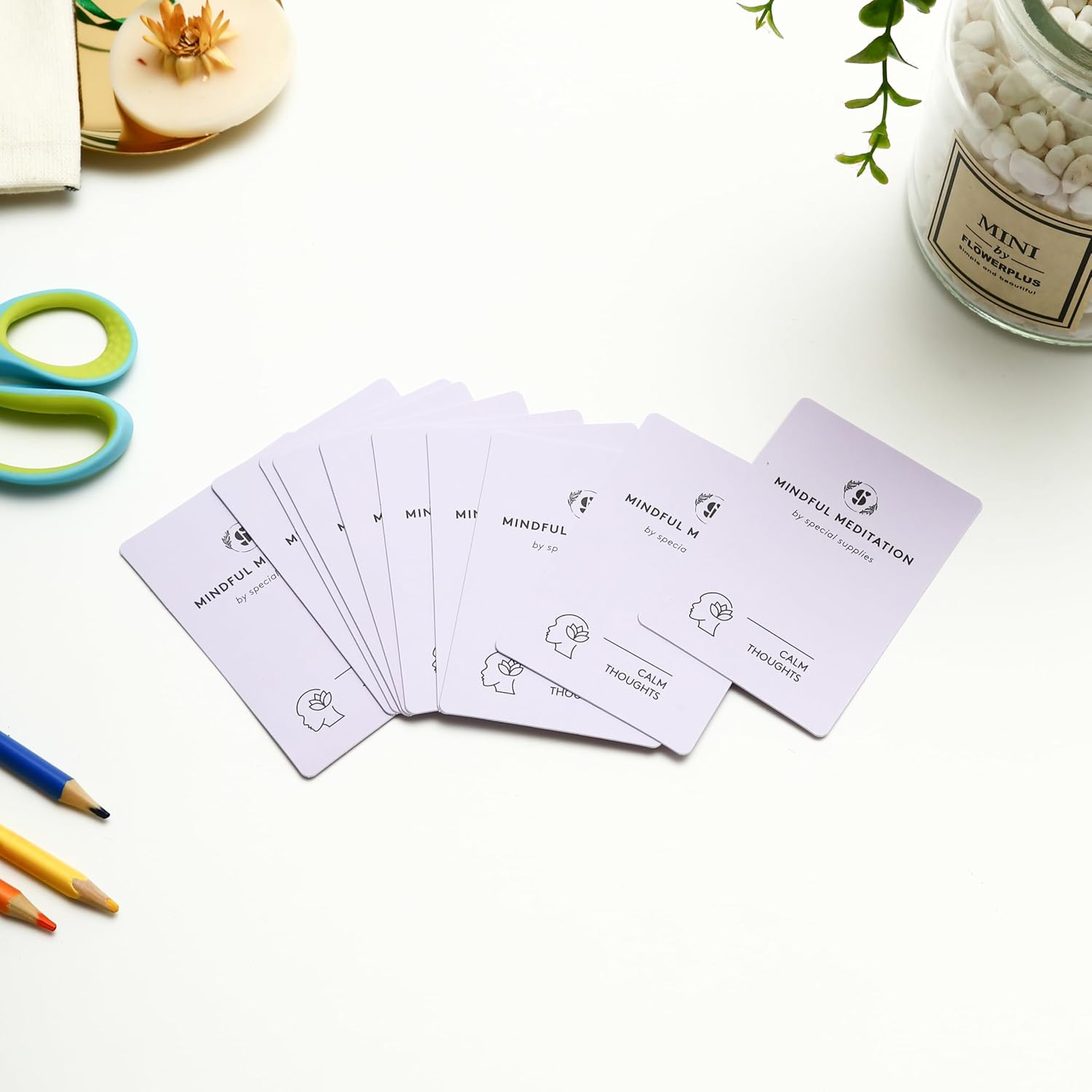 Mindfulness meditation cards laid out in a row with simple line icons on fronts.