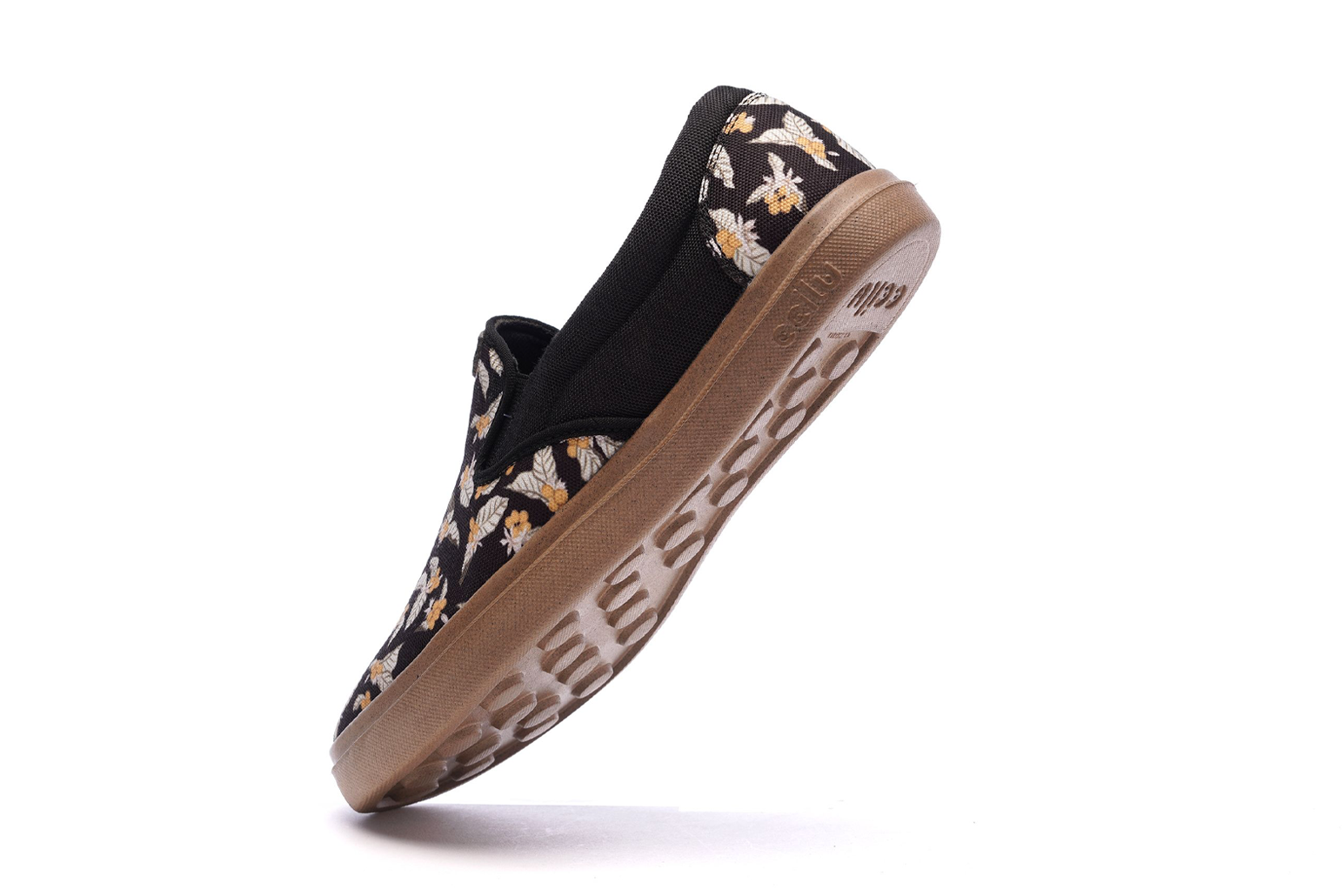 Men's slip-on sneakers side view with floral upper and tan rubber outsole