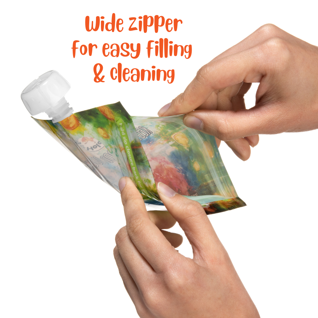 Reusable food pouch with wide zipper and white cap, held in hands