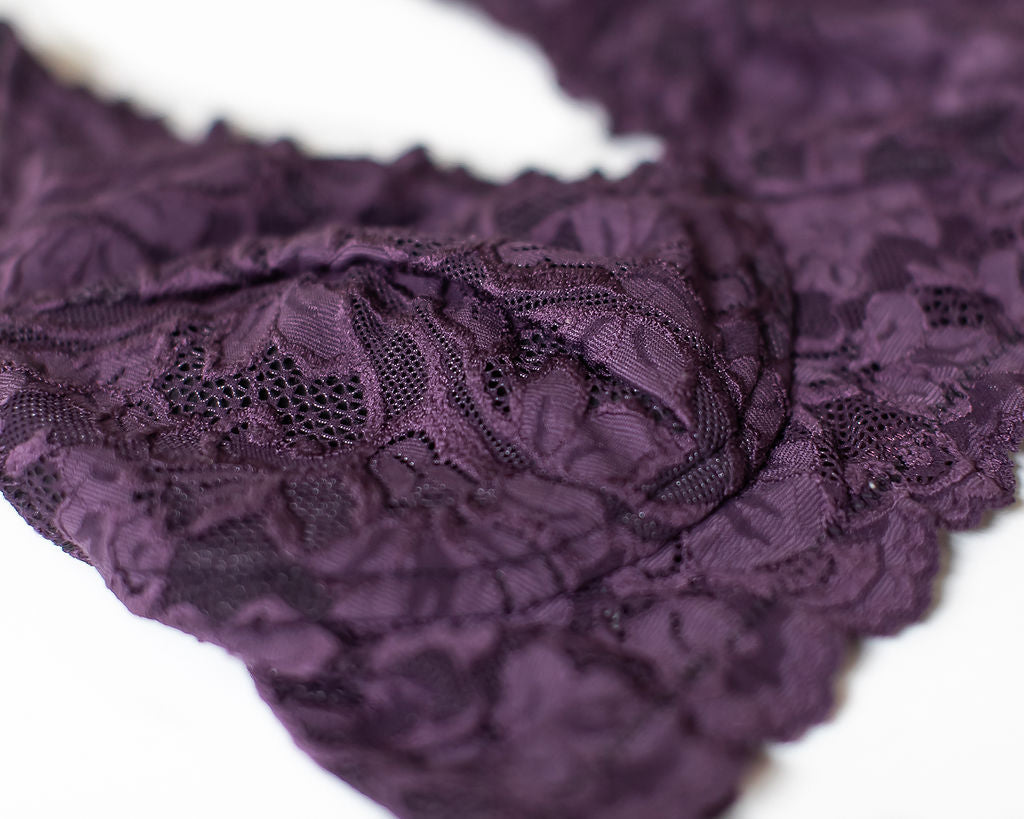 Close-up of orchid purple floral lace fabric on a wireless bra
