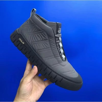 Gray high-top lace-up winter boots with quilted upper and thick tread sole