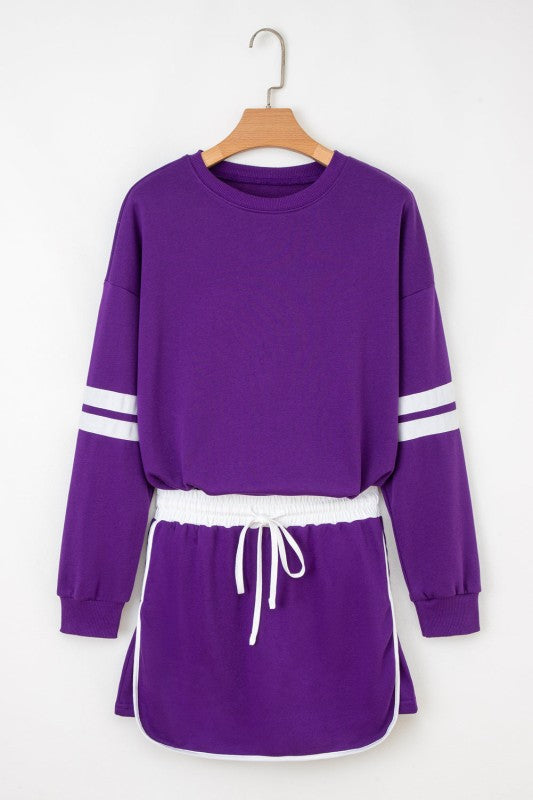 Purple crewneck pullover with white striped sleeves and drawstring mini skirt