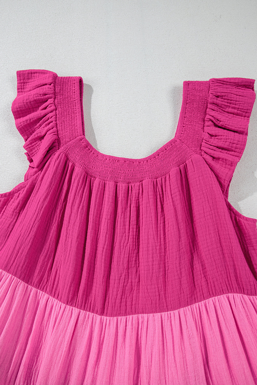 Pink tiered mini dress with square neckline and ruffled cap sleeves