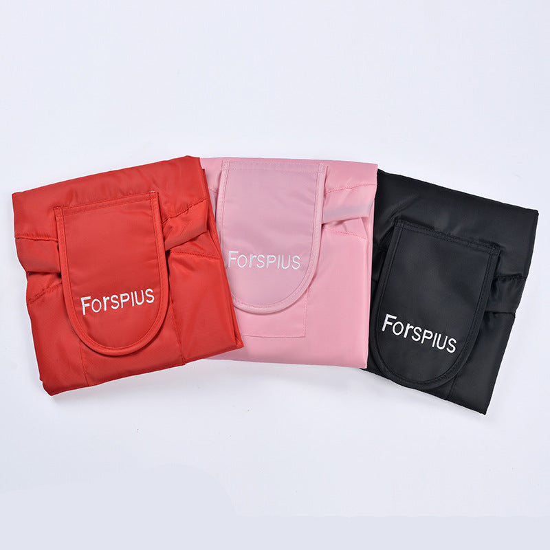 Set of three waterproof drawstring toiletry bags in red, pink, and black