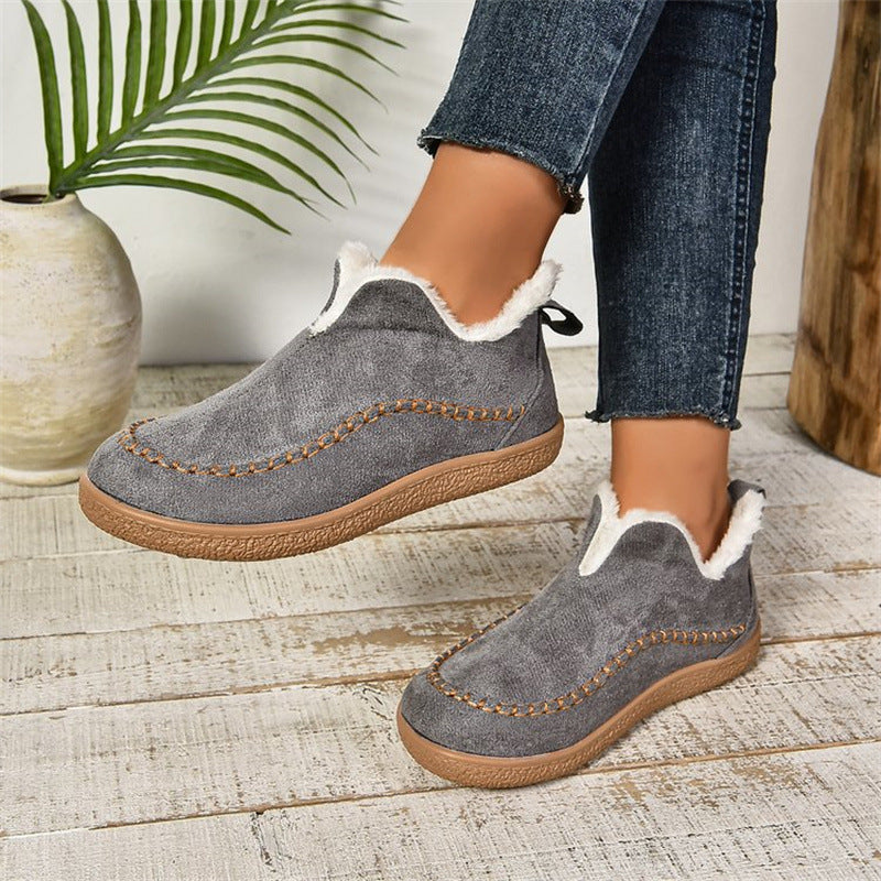 Women’s plush ankle boots in dark grey suede with faux-fur trim and stitched detailing
