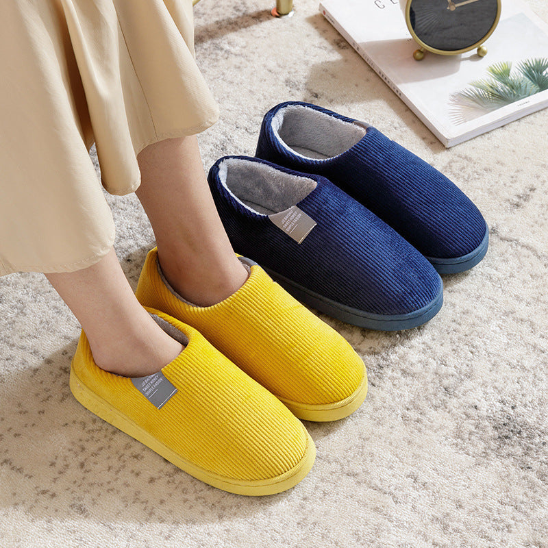 Women’s slip-on slippers in yellow and navy with fuzzy gray lining