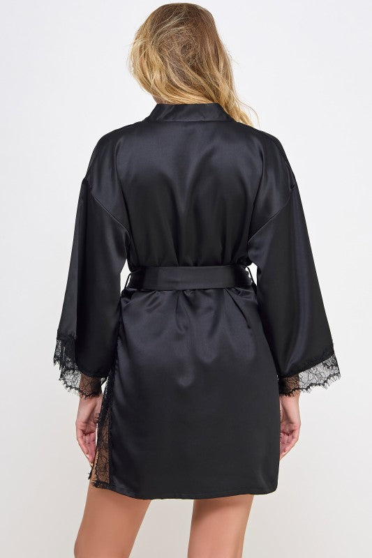 Black satin robe from back view with waist tie belt and lace-trimmed sleeve cuffs