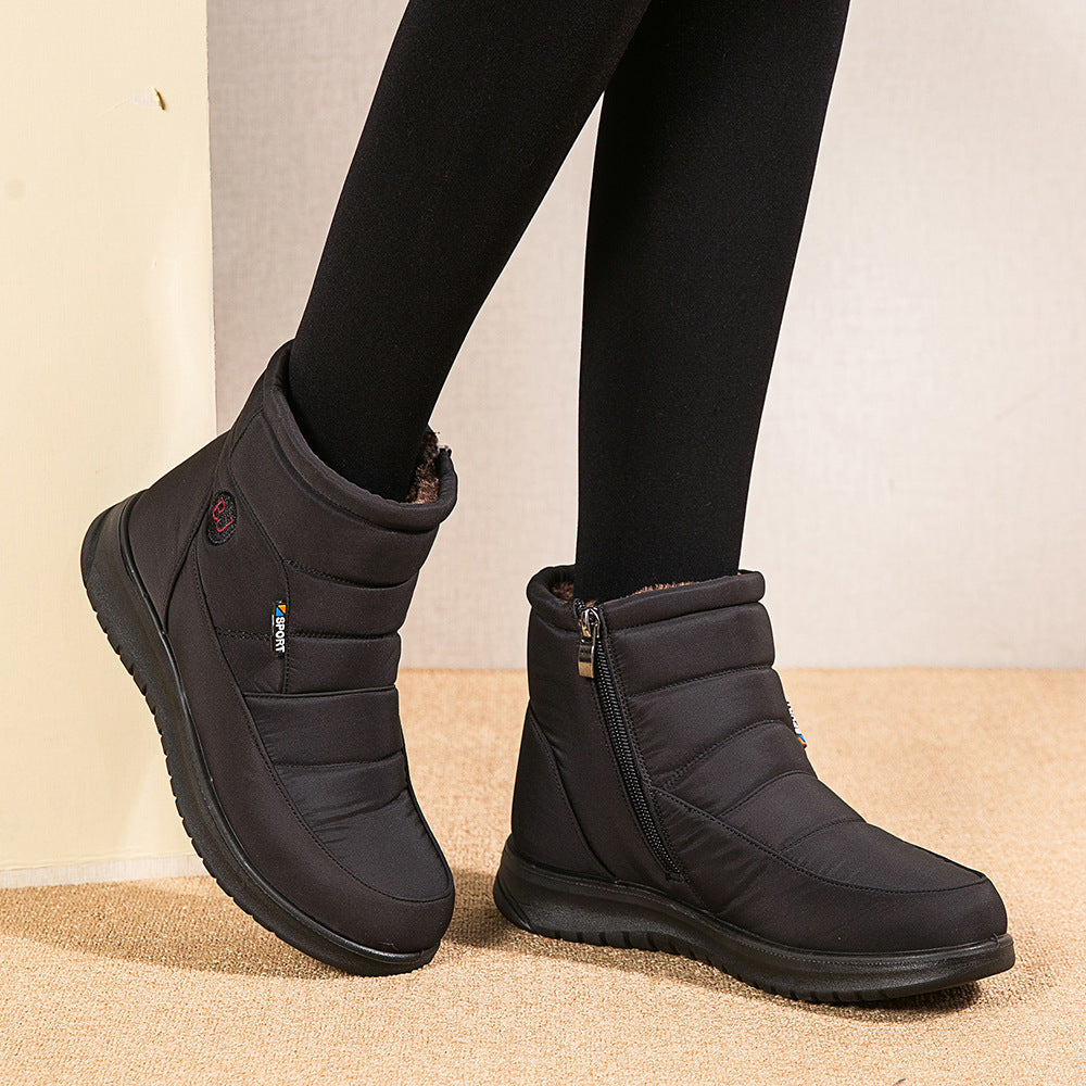 Women’s black ankle boots with side zipper and padded collar