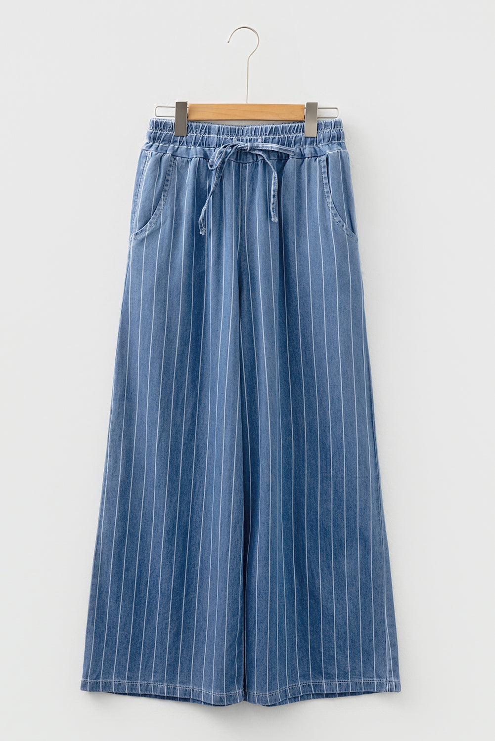 Blue pinstripe denim trousers with elastic waist and tie front, wide-leg