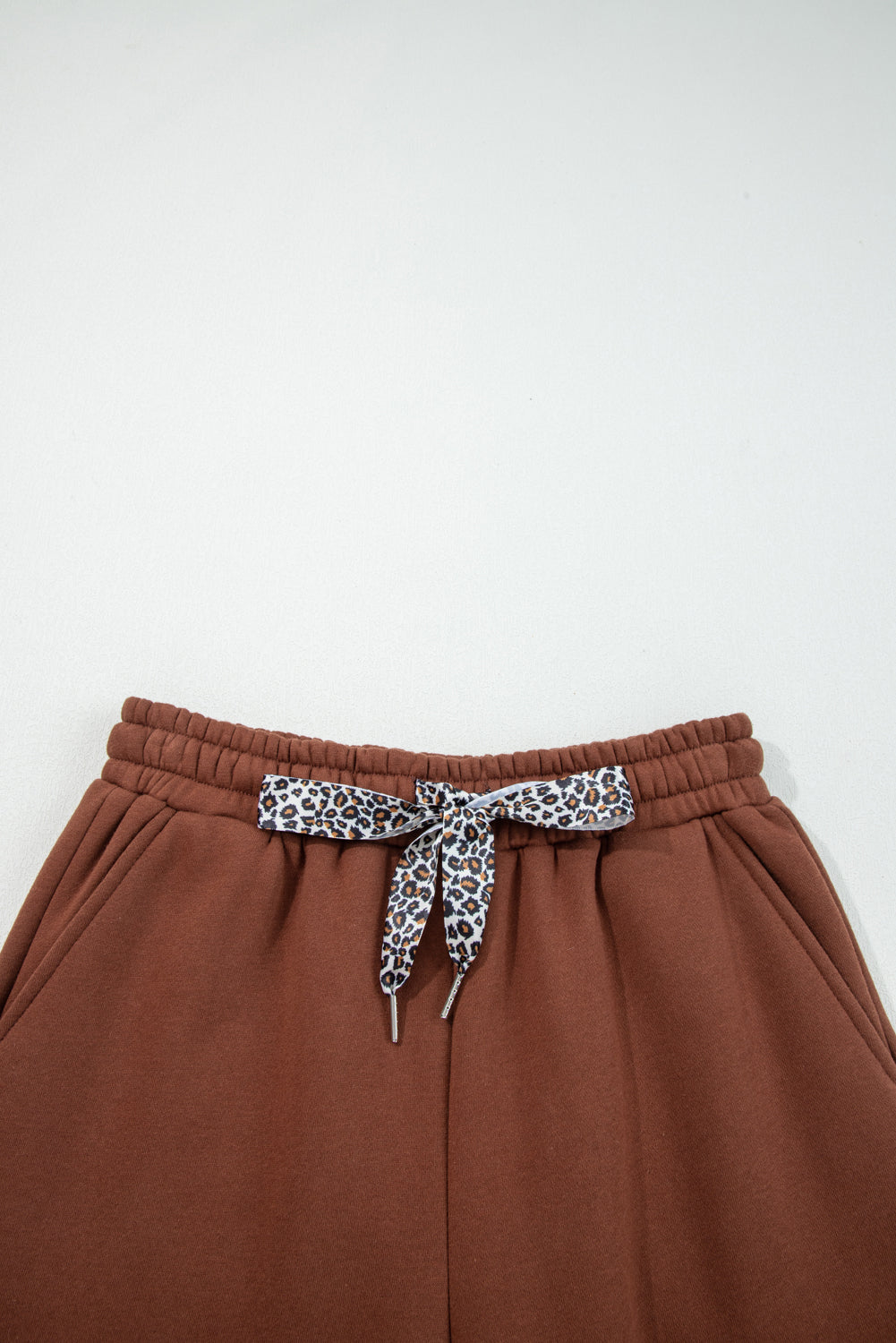 Coffee-brown elastic waist pants with leopard-print drawstring bow