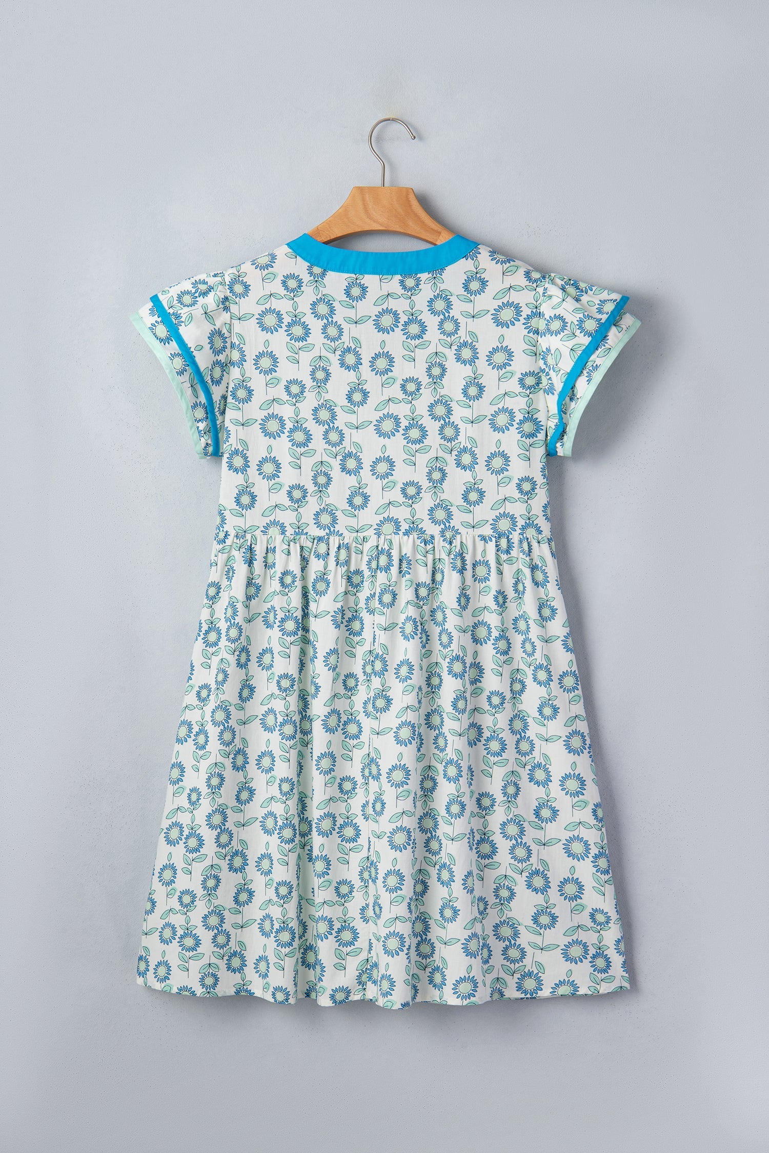 Sky blue flutter-sleeve mini dress on hanger with allover floral print
