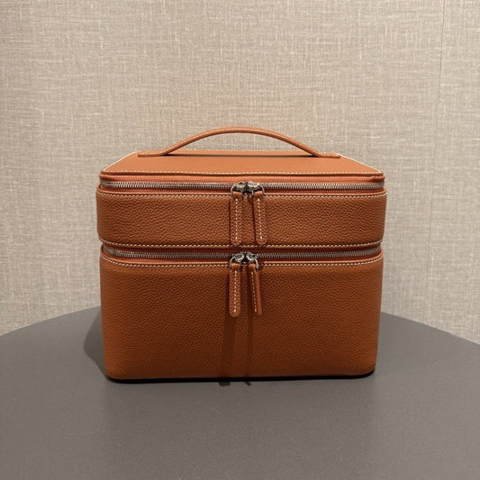 Brown leather-look jewelry storage tote with double zippers and top handle