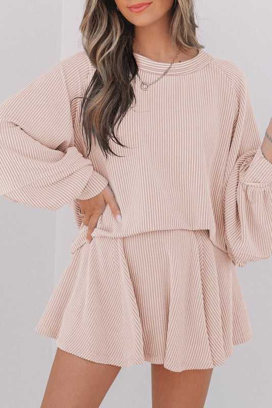 Pink corded top and ruffle mini skirt set with long sleeves and pleated skirt